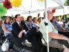 Residents, board members and volunteers sit and watch the opening ceremony for the new bridge. - By Adam Eschbach
