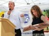 Project Manager Rodger Mason, of CH2M Hill awards Public Works Director Maiya Andrews a replica plaque of the May Creek Bridge at the ceremony. - By Adam Eschbach
