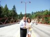 Mayor Ben Varon and his wife Julie hold up a plaque dedicated to the completion of the new May Valley Bridge. - By Adam Eschbach
