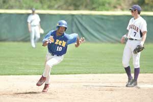 baseball-hhs-pina-20080517 Hazen sophomore Anthony Pina rounds second base and scores the Highlanders first run in their state playoff game May 17 against Issaquah High School. Hazen head coach Chris Chiechi (below) was named Seamount League coach of the year. Photo by Greg Farrar