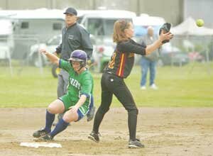 fastpitch-lhs-faor-20080523 Liberty’s Kate Faoro steals second base, beating the throw to Enumclaw shortstop Taylor Franich in first round fastpitch state playoff action. Photo by Greg Farrar