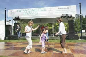 newcastle-days-20070908c Mothers and daughters dance to ‘Johnny B Goode’ and other classic rock ’n’ roll performed by BD and the Rockits on the Main Stage during Newcastle Days.