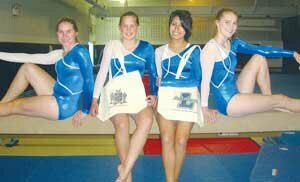 lhs-gymnast-bags-20080800 Liberty High School gymnasts (from left) Miranda Jones, Hannah Bergam, Cammie Fuentes and Michelle Vanderheyden pose with the two styles of canvas bags for sale through their team’s fundraiser. Photo contributed