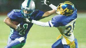 football-hhs-20-20081010 Isaiah Fullerton-Talley (20), Hazen sophomore defensive back, gets a facemask grab in the second quarter from Liberty senior running back Joseph Yea, in their Oct. 10 football game. Photo by Greg Farrar