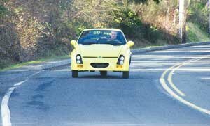ecology-car-tech-20090211b Joner takes the EMC Commuter for a spin along Newcastle Way. By Jim Feehan