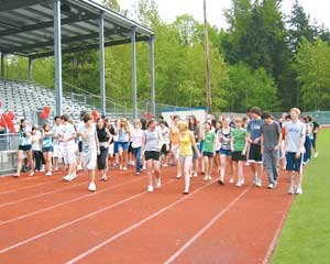 lhs-walkathon-20080400 Liberty High School’s National Honor Society students at last year's walkathon start the first lap on the school track to raise money for library books for Liberty, and for student-life programs at a school and college in Mumbai, India. Contributed