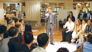 Contributed Paul Neville, a Liberty High School graduate (center), speaks at a cultural exchange presentation in the form of a fashion show in Chiang Mai, Thailand, on July 4, 2012.