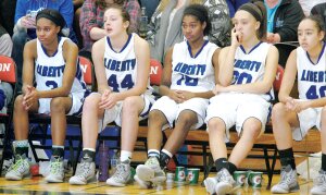 By Greg Farrar Sitting sadly on the bench after the Demps sisters fouled out in the closing moments of Liberty’s 50-71 loss to East Valley are (from left) senior Cherelle Demps, junior Alissa Campbell, senior Danielle Demps, junior Savannah Metzger and sophomore Kylie Kirksey.