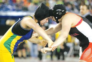 By Greg Farrar Raven Svenson (left), Hazen High School sophomore, wrestles Charliann McCall of Centralia at 155 pounds, eventually winning by pin at 2:31 in her first match at the Mat Classic XXVII state 3A championship tournament Feb. 20 at the Tacoma Dome. Svenson went on to win fifth at state.